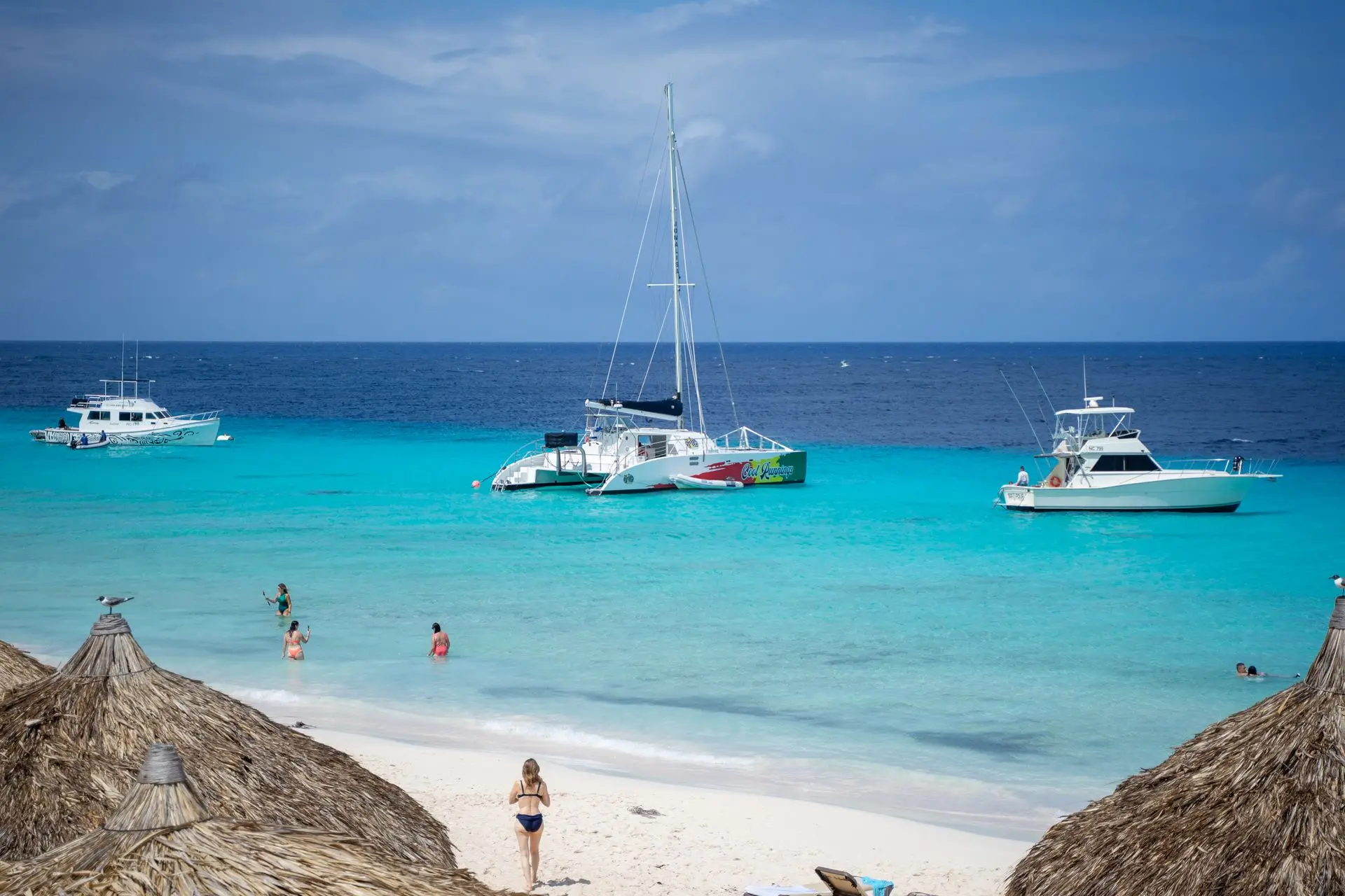 Beach and boats in turquoise water, Curaçao